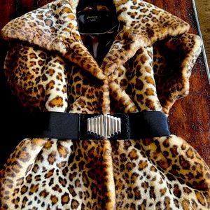 Beautiful faux fur vest. Lined. 2 closures with belt.  Worn once.